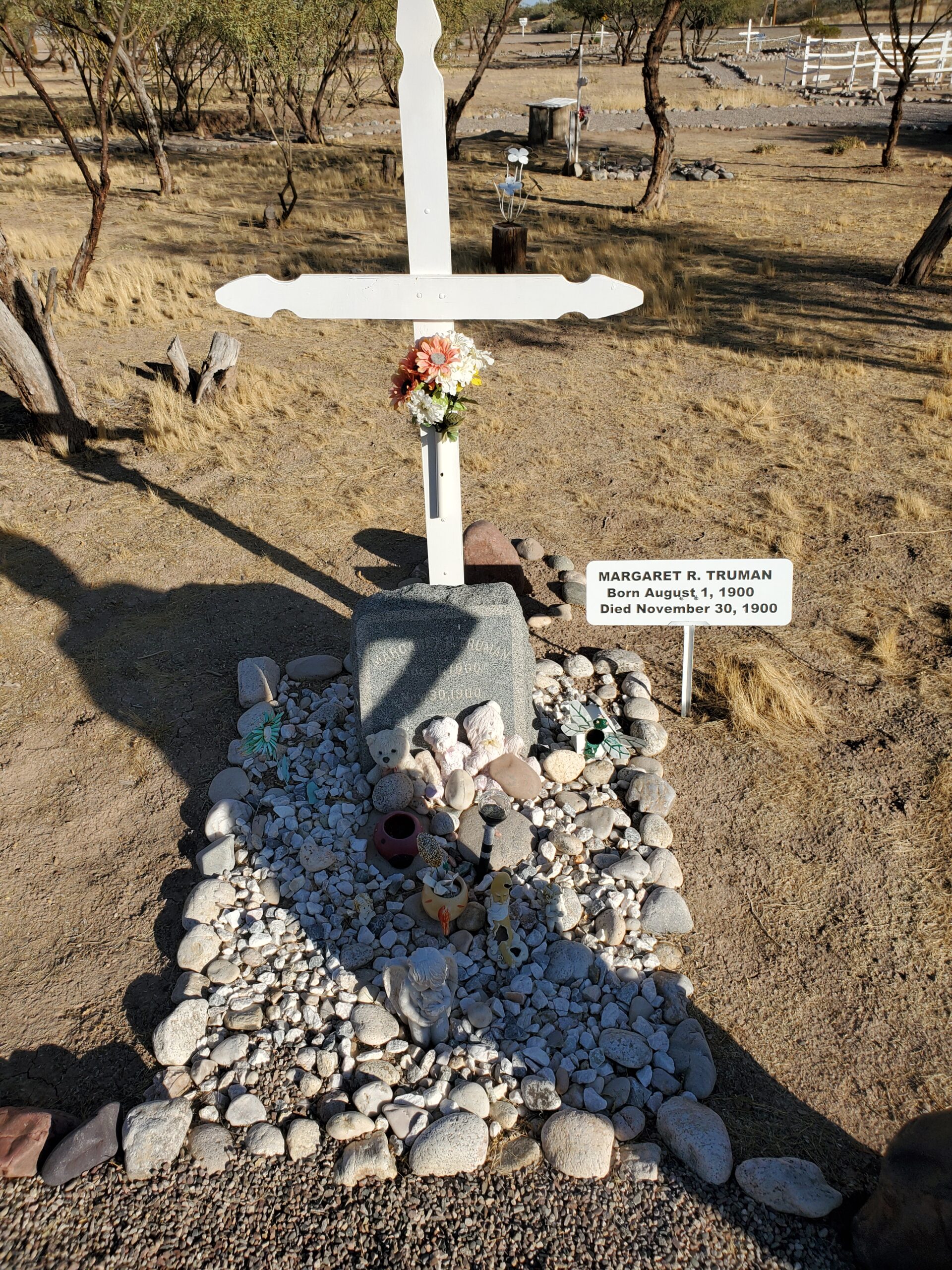 Margaret's grave has a white cross and a small placard explaining her name, birth and death dates.