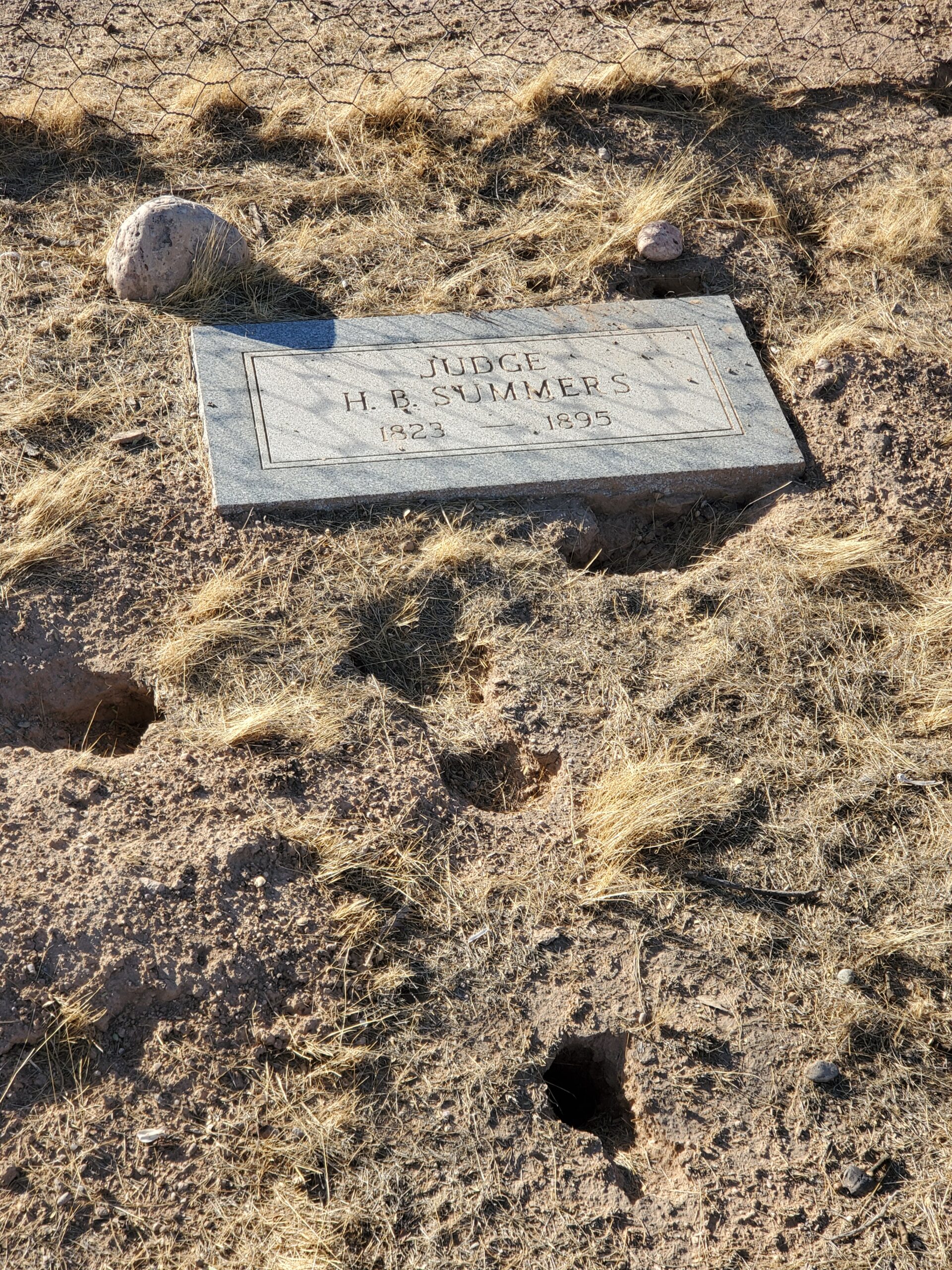 This simple headstone marks the final resting place of a judge from before Arizona became a state